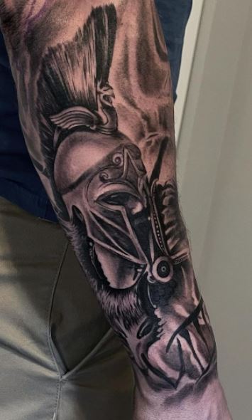 Spartan tattoo on the arm for men