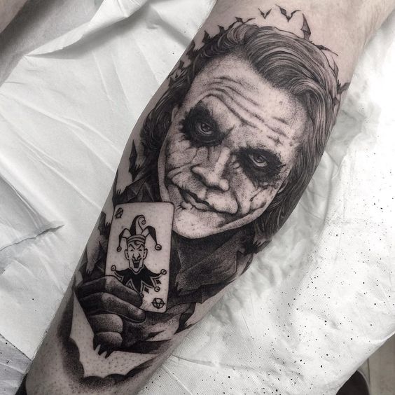 Joker tattoo on the calf for men