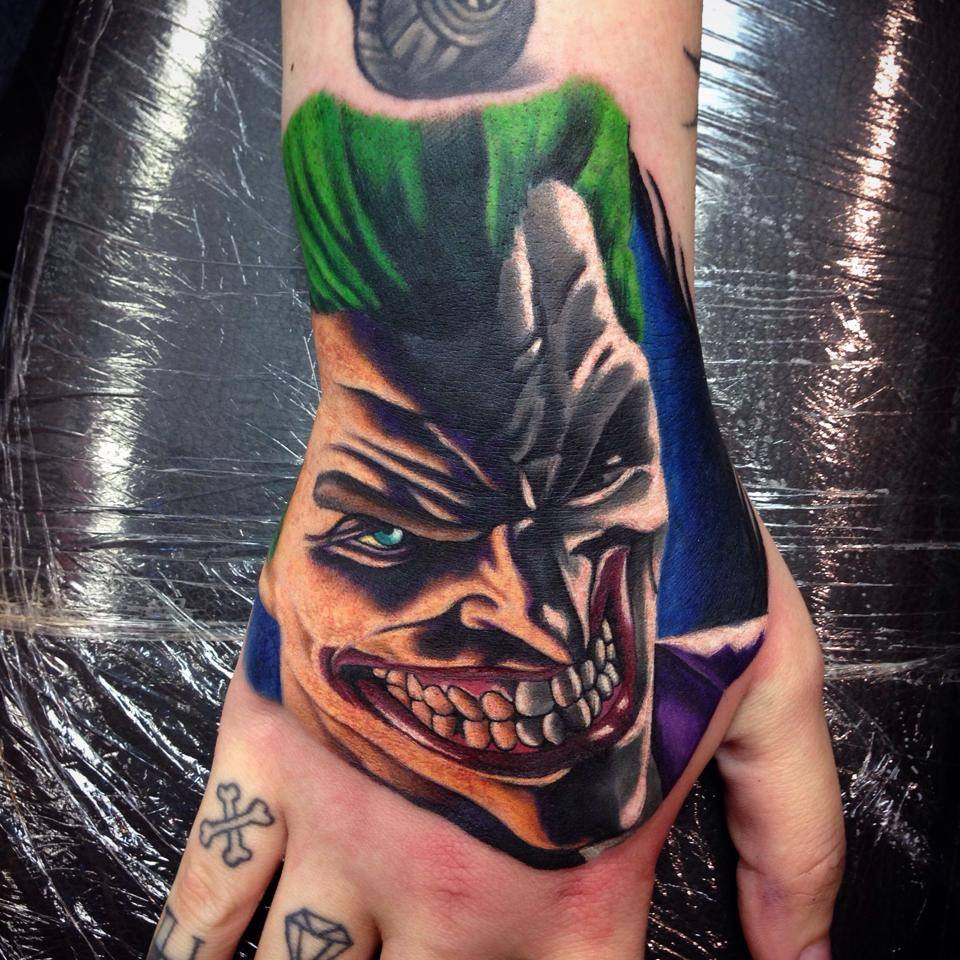 Joker tattoo on the wrist