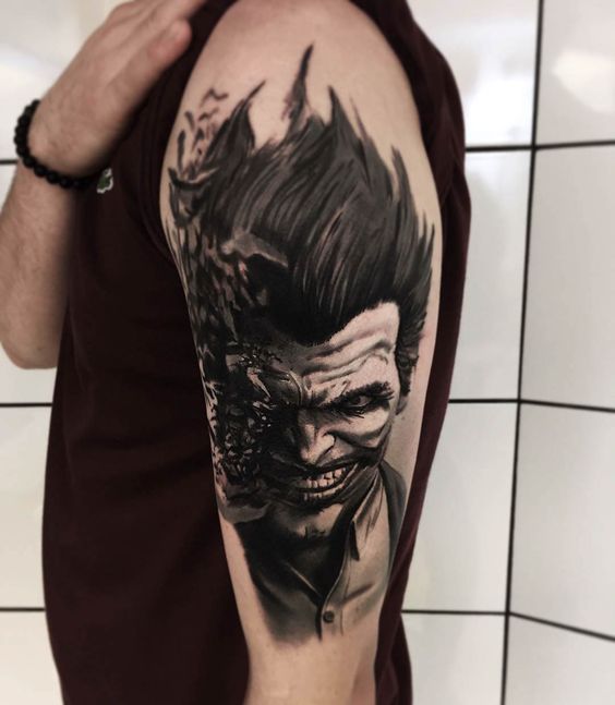 Tattoo of the joker on the shoulder for men