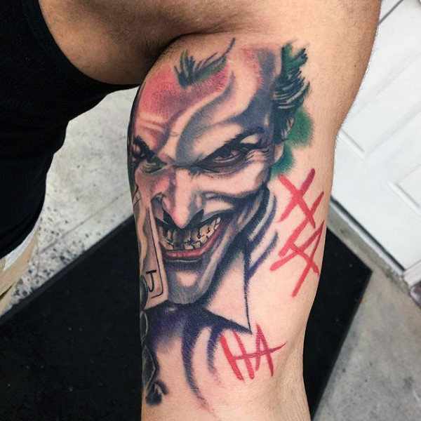 Tattoo of the joker on the shoulder for men