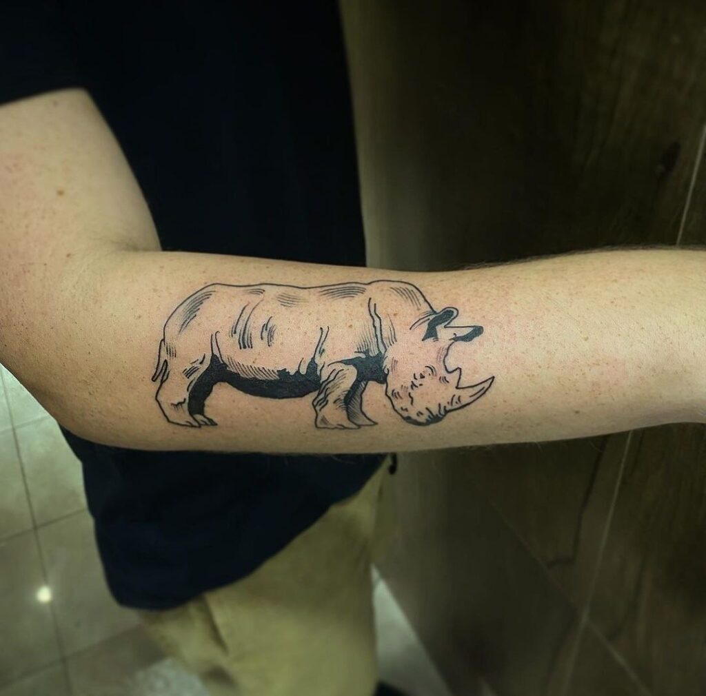 Rhinoceros tattoo on the forearm for women