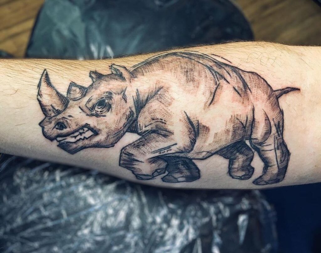 Rhinoceros tattoo on the forearm for men