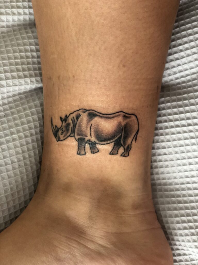 Rhinoceros tattoo on the shin for women Rhinoceros tattoo on the shin for women