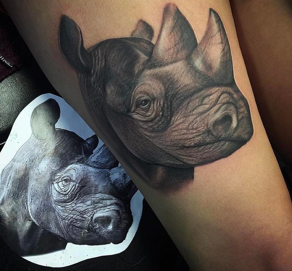 Rhinoceros tattoo on the thigh for women