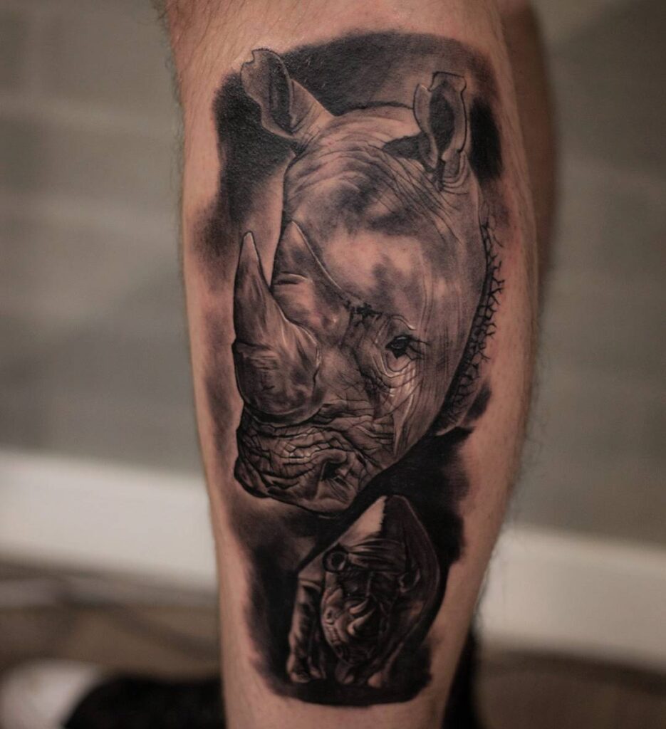 Rhinoceros tattoo on the shin for men