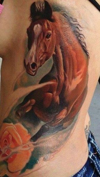 Horse tattoo on the side for women