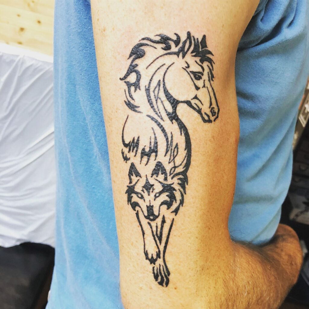 Tattoo of a horse on the shoulder for men