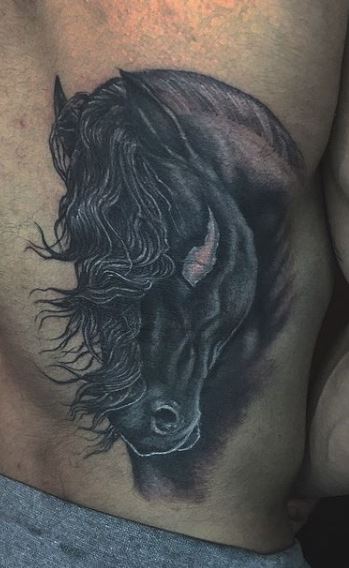 Tattoo of a horse on the back for men