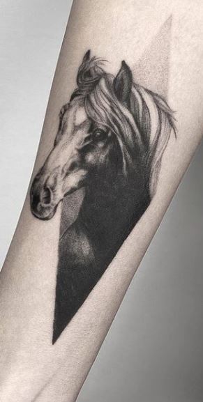 Horse tattoo on the forearm for women