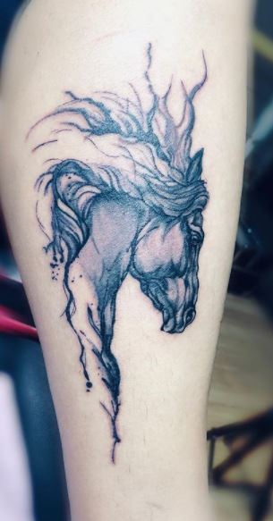 Horse tattoo on the forearm for women