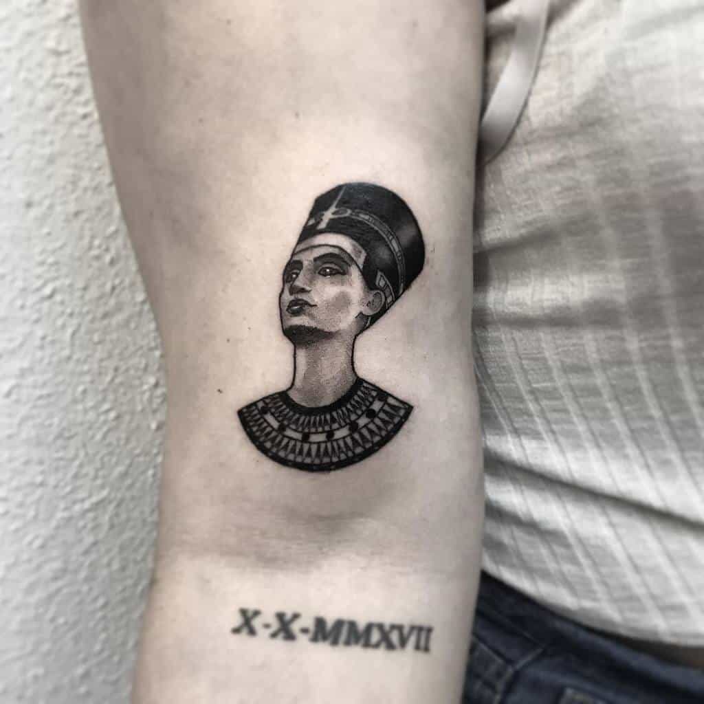 Tattoo of Nefertiti on the shoulder for women