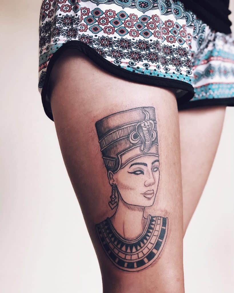 Tattoo of Nefertiti on the thigh for women