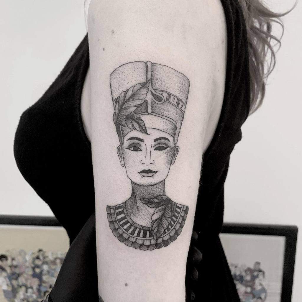 Tattoo of Nefertiti on the shoulder for women