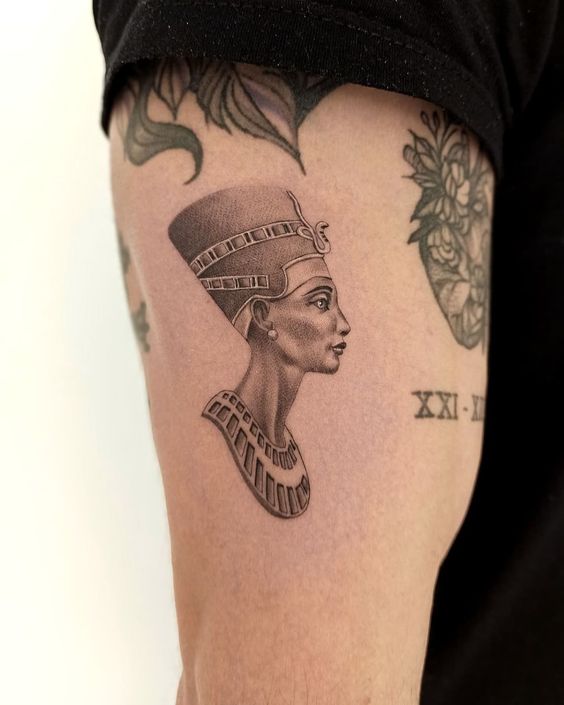 Tattoo of Nefertiti on the shoulder for men