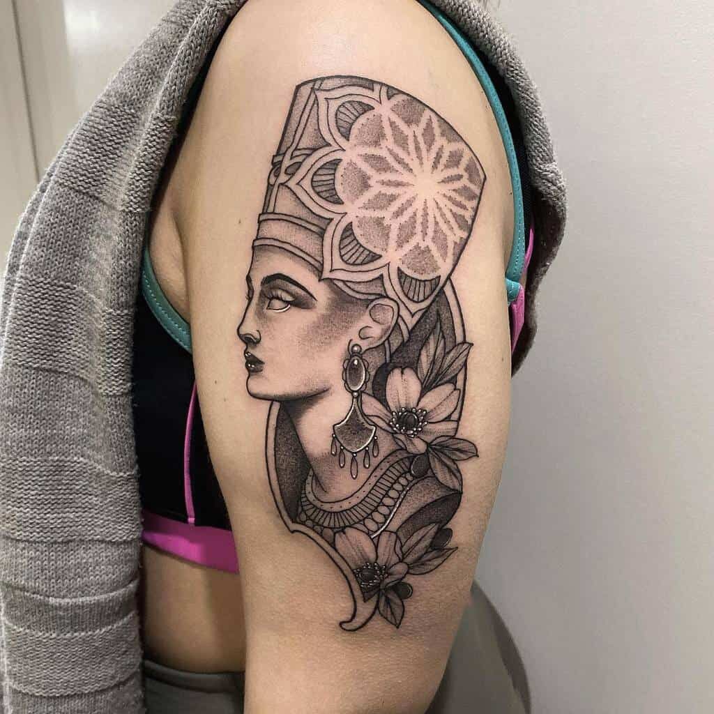 Tattoo of Nefertiti on the shoulder for women