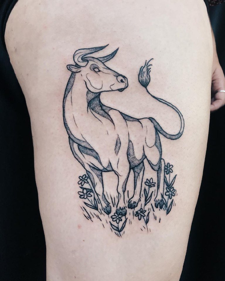 Bull tattoo on the hip for women