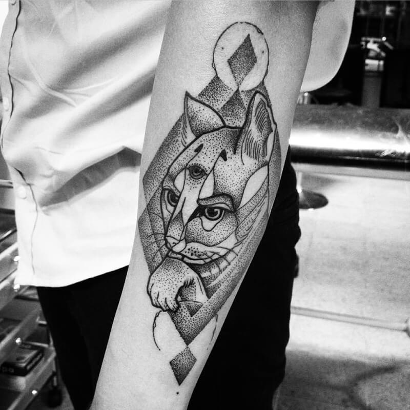 Cat tattoo on the forearm for men