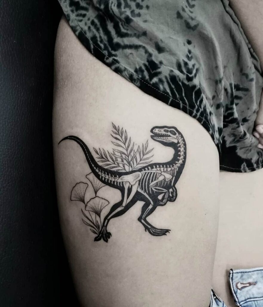 Dinosaur tattoo on the hip for women