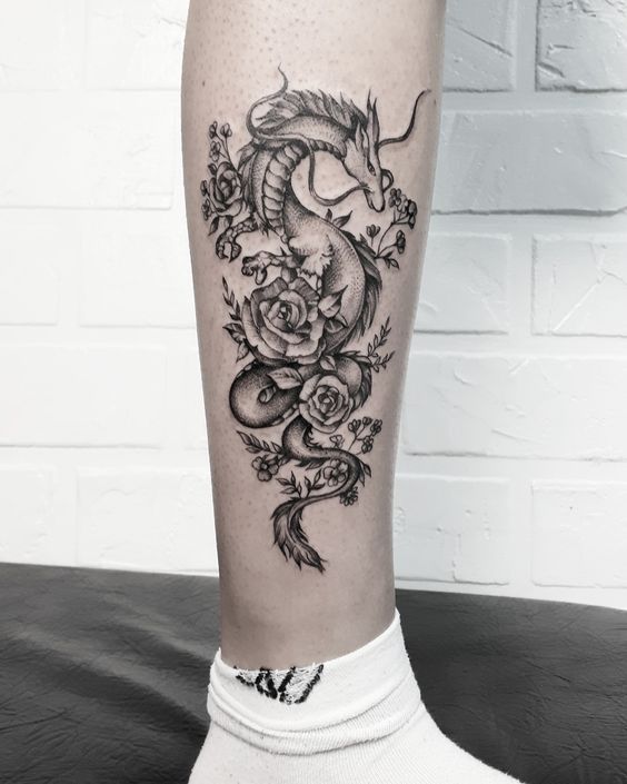 Dragon tattoo on the shin for women