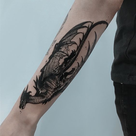 Dragon tattoo on the forearm for men