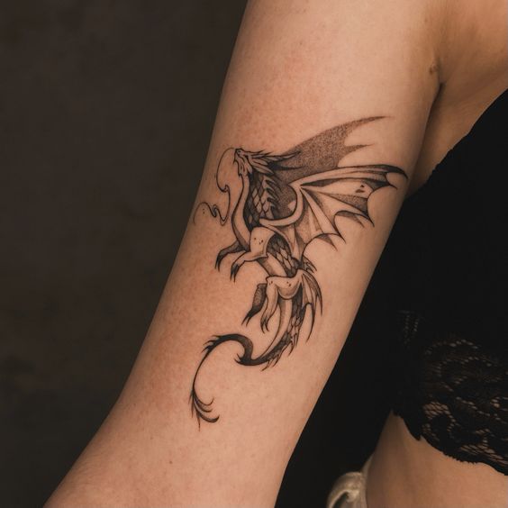 Dragon tattoo on the shoulder for women