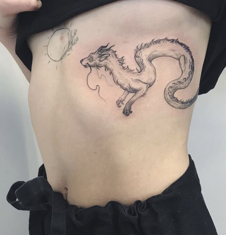 Dragon tattoo on the side for women