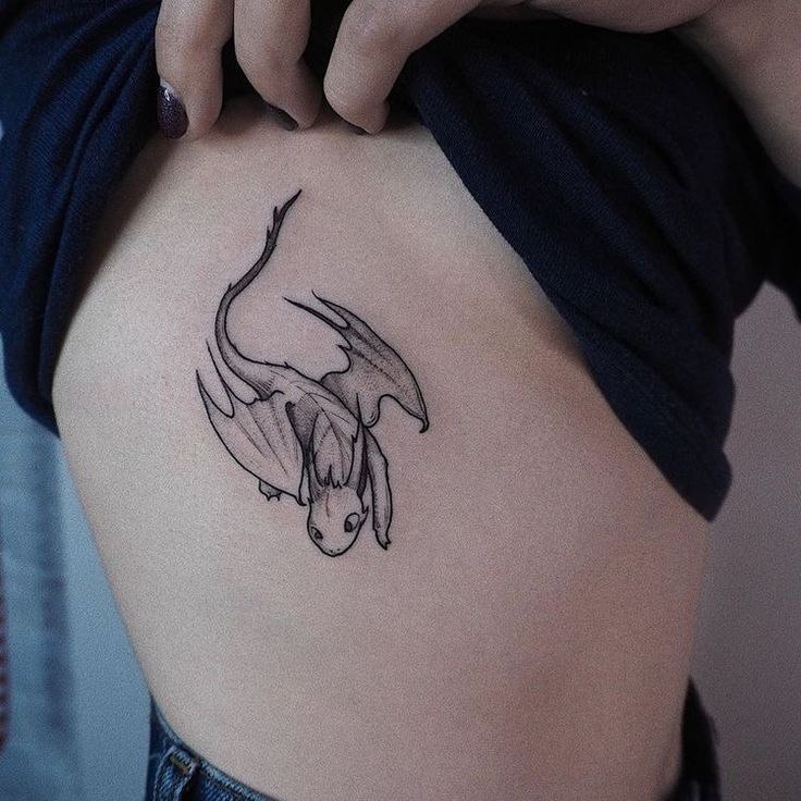 Dragon tattoo on the side for women