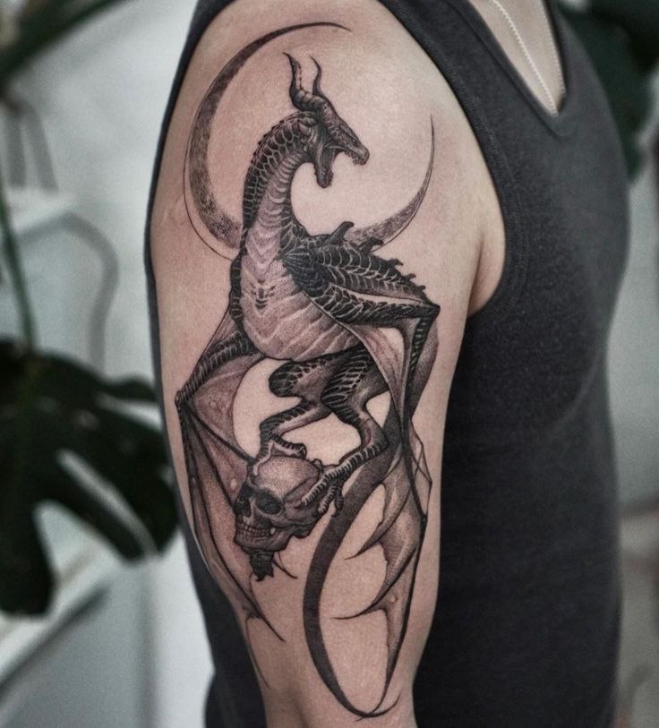 Dragon tattoo on the shoulder for men