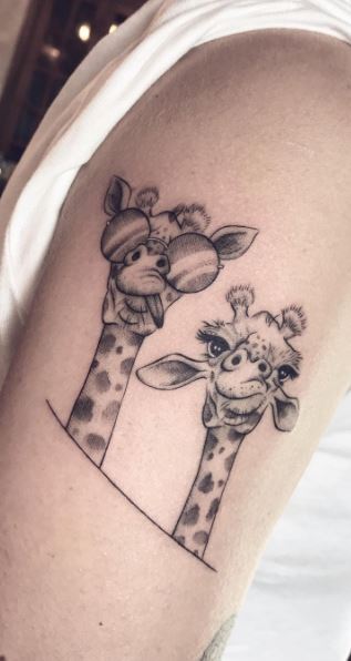 Giraffe tattoo on the shoulder for women