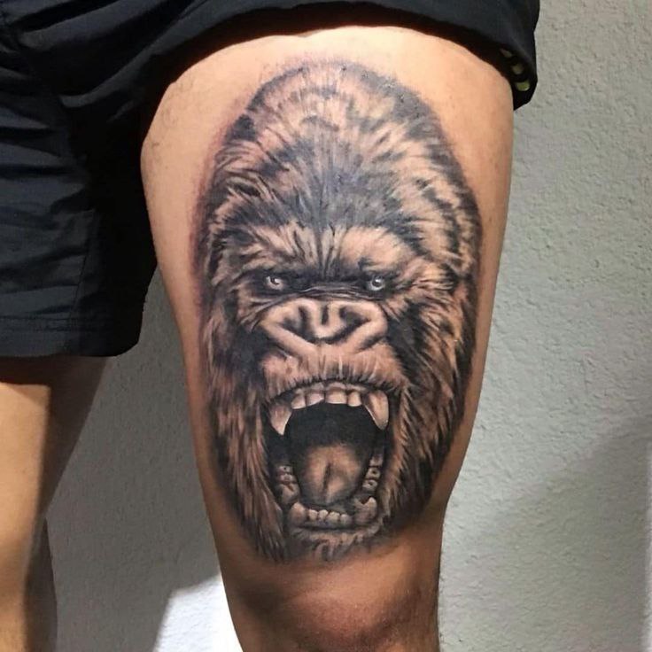 Gorilla tattoo on the thigh for men