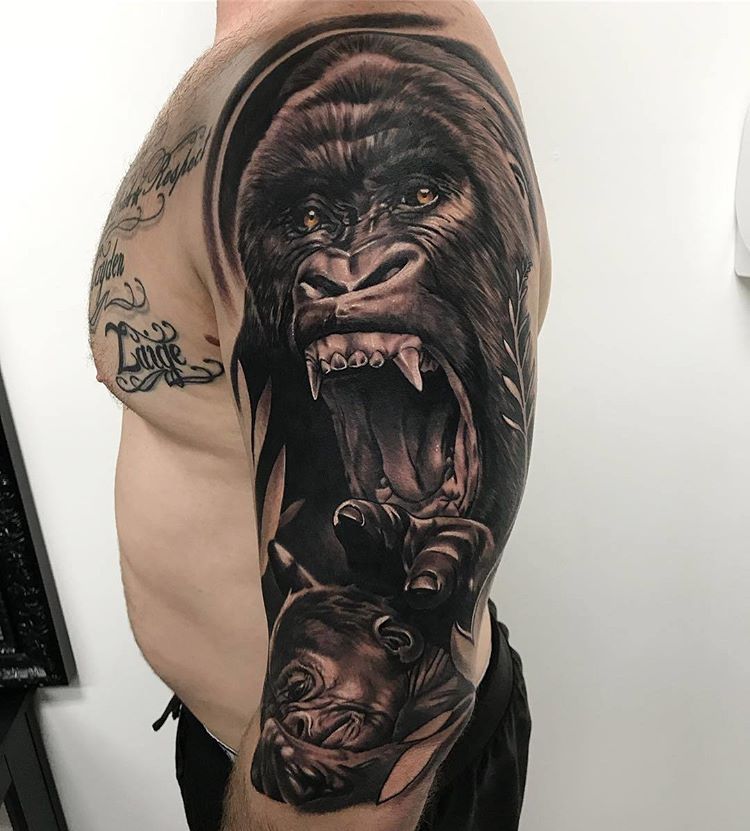 Tattoo of a gorilla on the arm for men