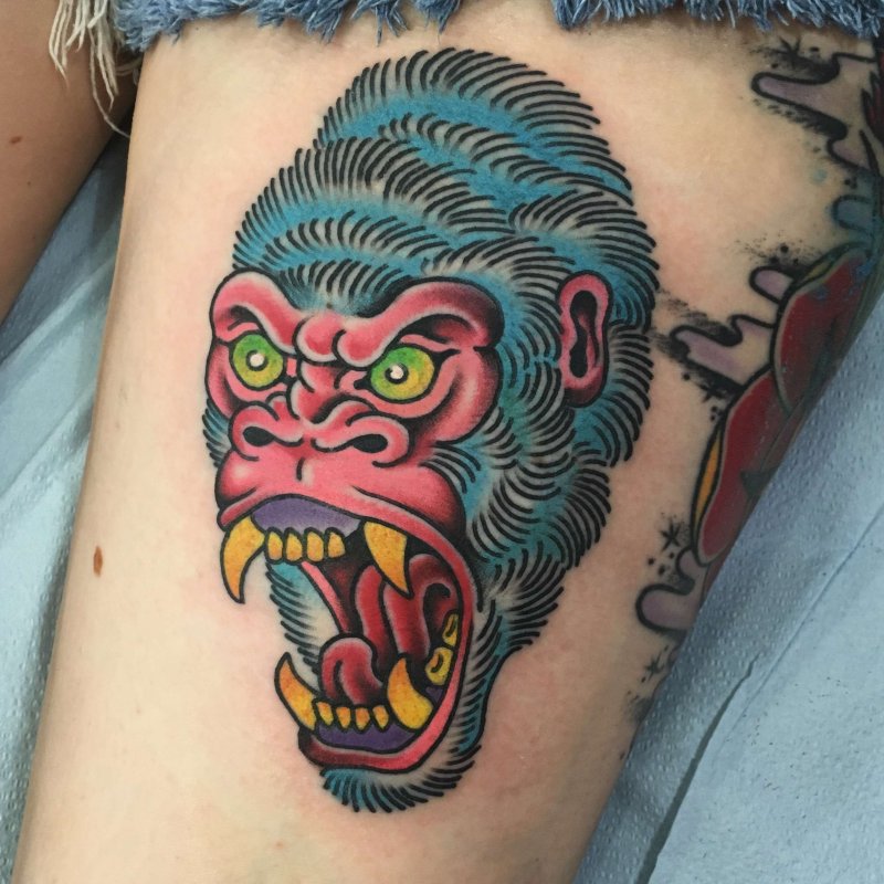 Gorilla tattoo on the thigh for women