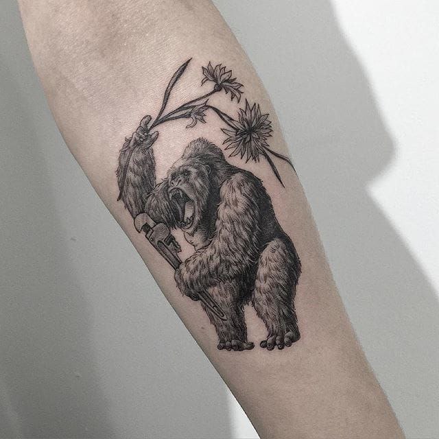 Gorilla tattoo on the forearm for women