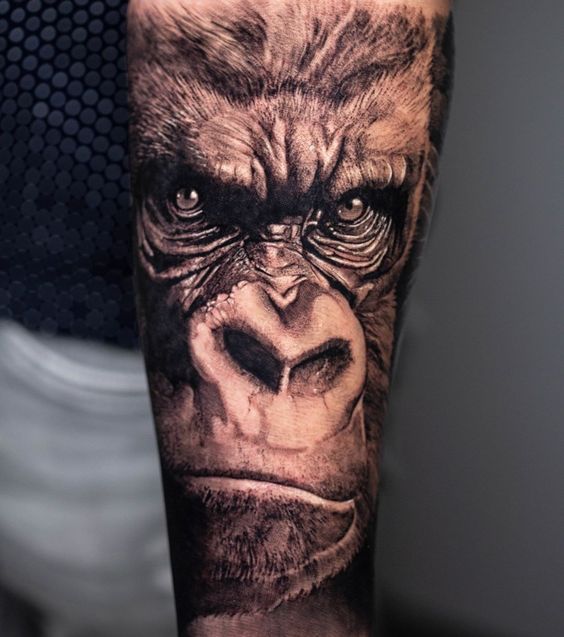 Tattoo of a gorilla on the arm for men