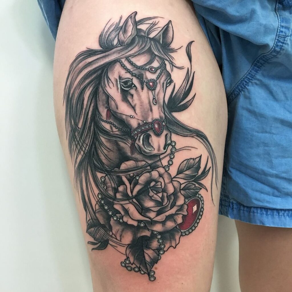 Tattoo of a horse on the hip for men