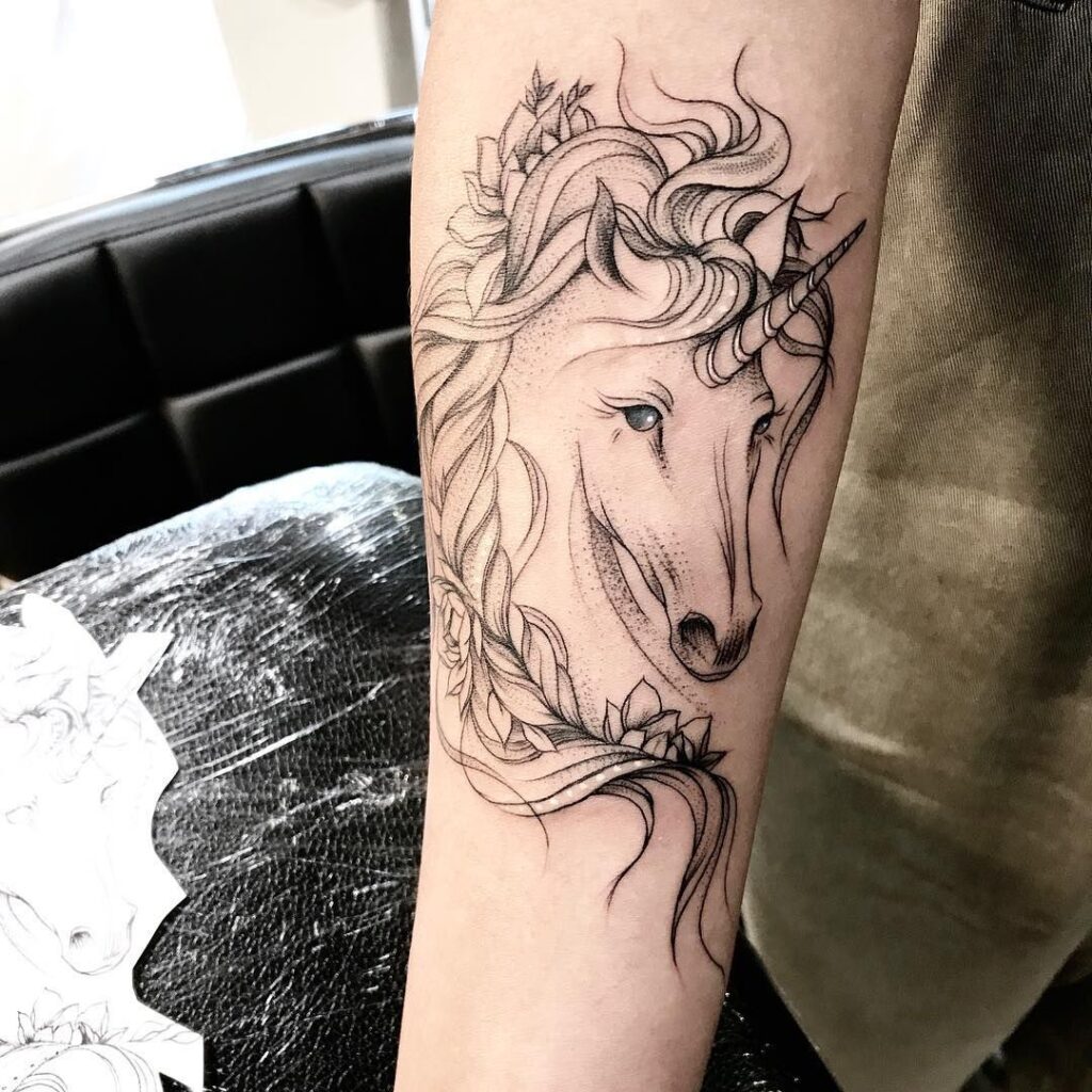 Horse tattoo on the forearm for women