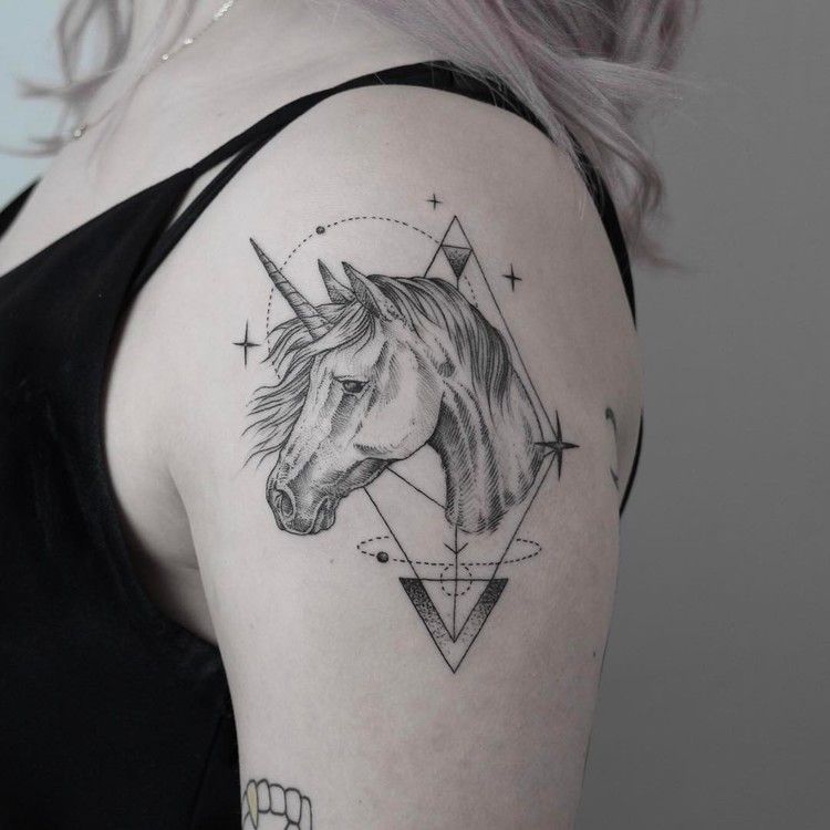 Tattoo of a horse on the shoulder for women