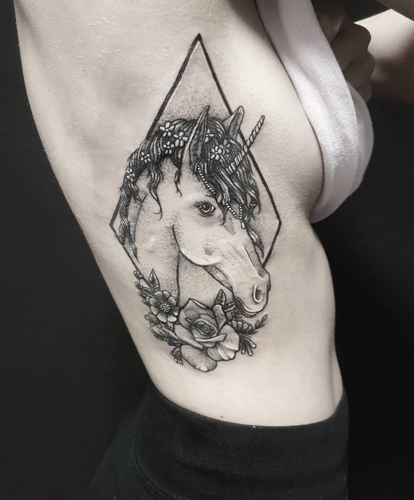 Horse tattoo on the side for women