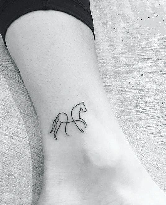 Tattoo of a horse on an ankle for women