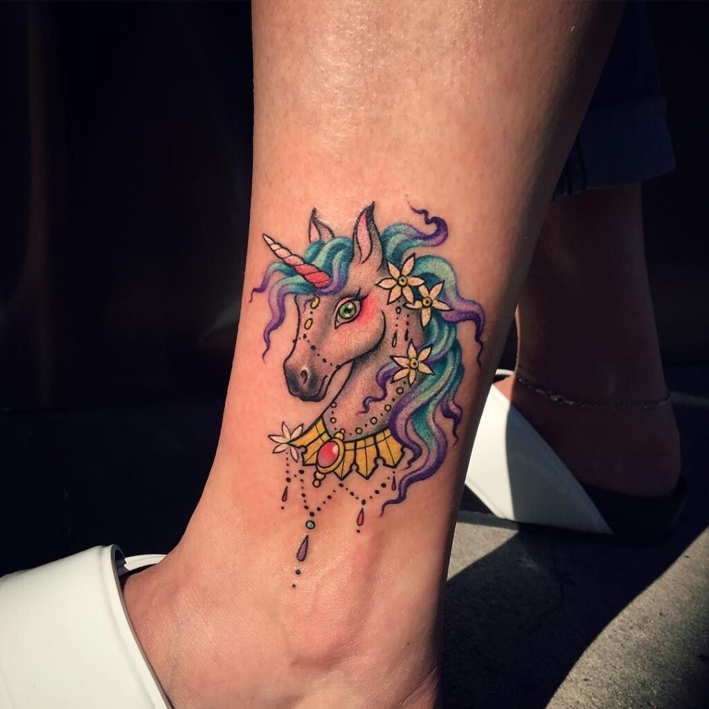 Tattoo of a horse on the leg for women