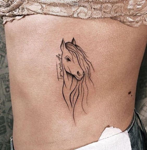 Horse tattoo on the side for women