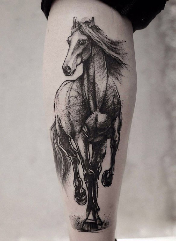 Tattoo of a horse on the calf for men