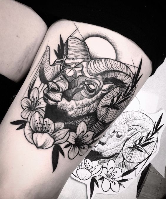 Tattoo of a ram on the hip for women