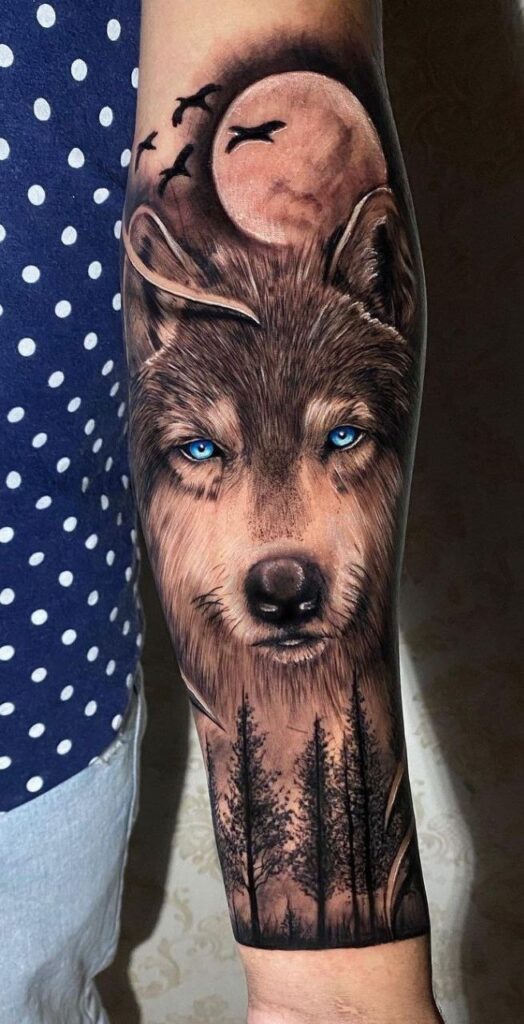 Tattoo of a wolf on the arm for men