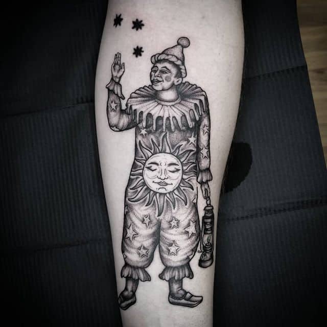 Tattoo of a jester on the forearm for women