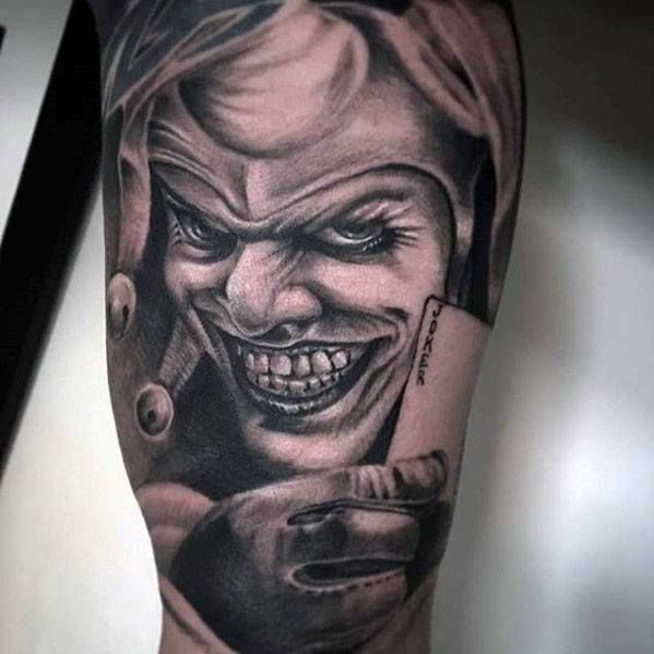 Tattoo of a jester on the leg for men