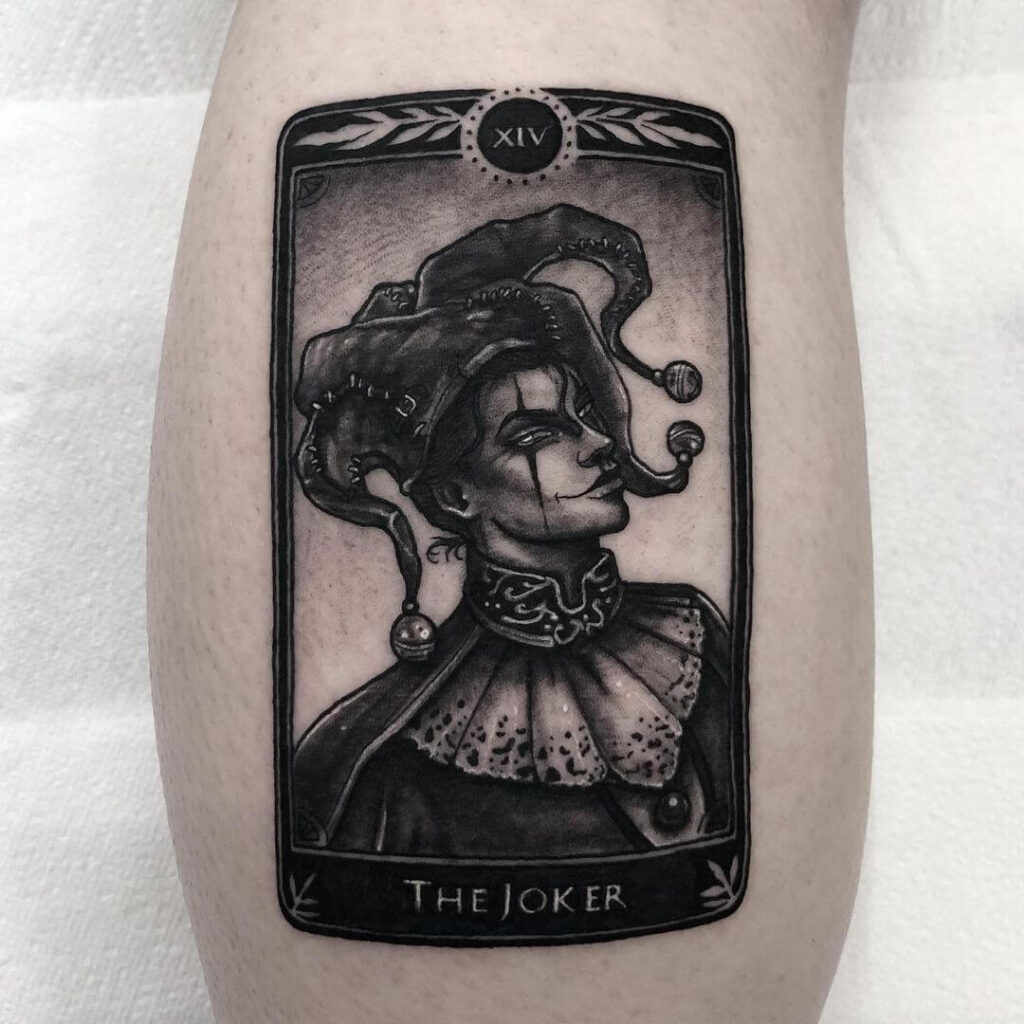 Tattoo of a jester on the leg