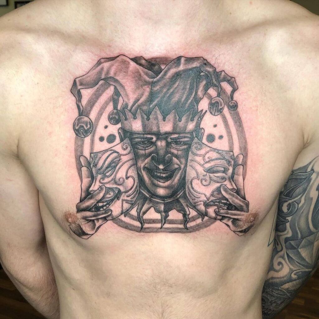 Tattoo of a jester on the chest for men