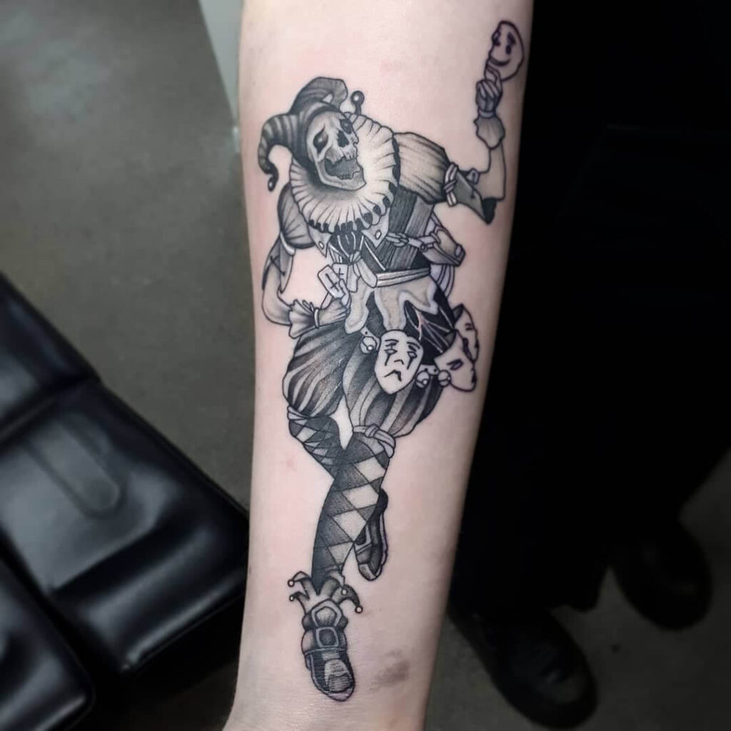 Tattoo of a jester on the forearm for men